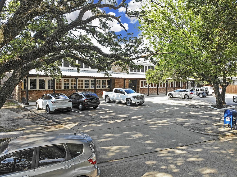 Live oaks shading the parking lot